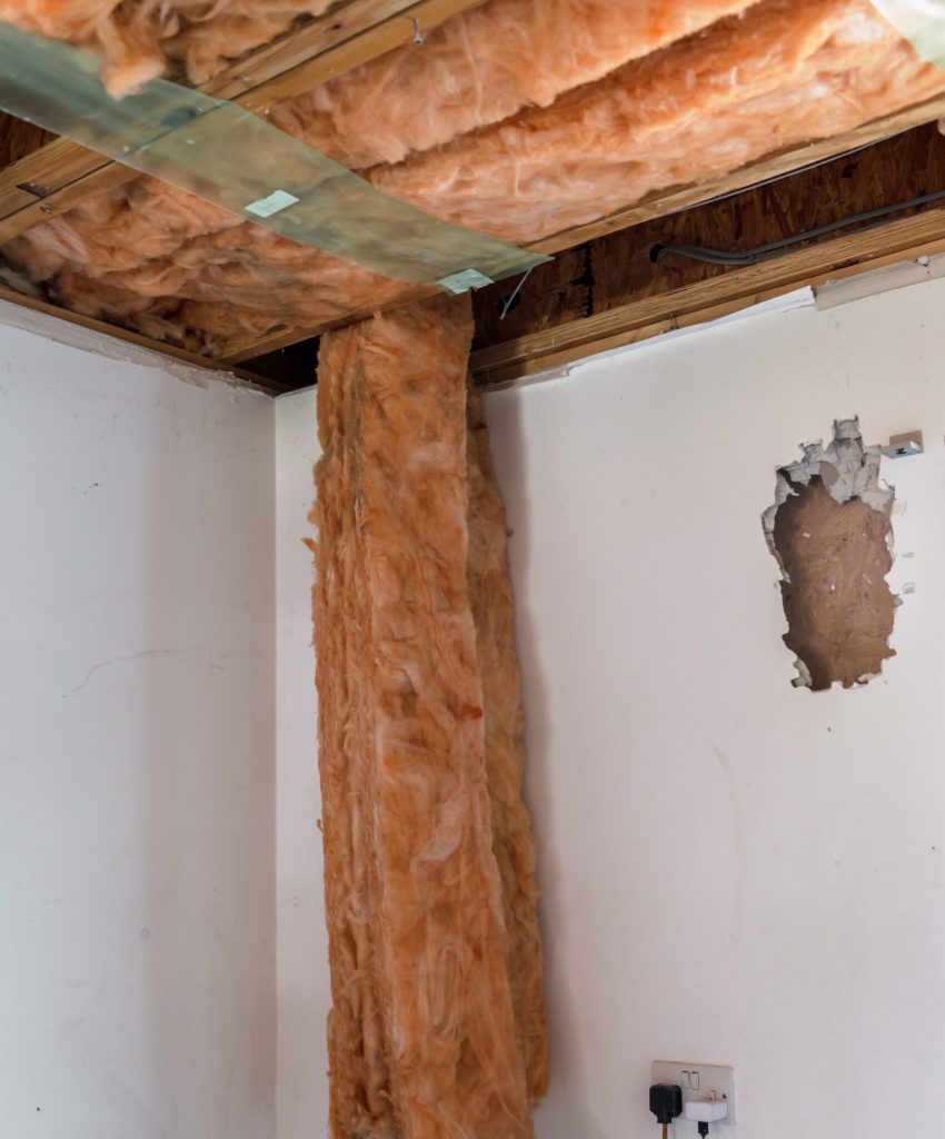 Deconstruction of room and garage with removing walls. No ceiling and floor. Big renovation project, wall removal and opening
